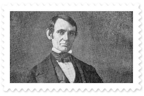 A black-and-white portrait of a young Abraham Lincoln wearing a black suit.