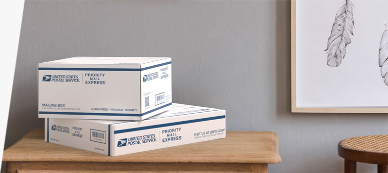 Two Priority Mail Express International® boxes sitting on a table.