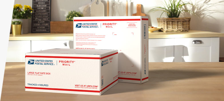 Two Priority Mail International® boxes sitting on a table.