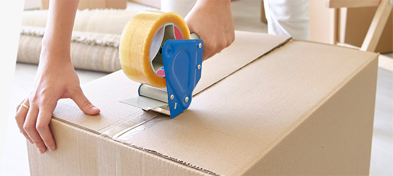 Customer using 2 inch-wide clear packaging tape to reinforce box seams.