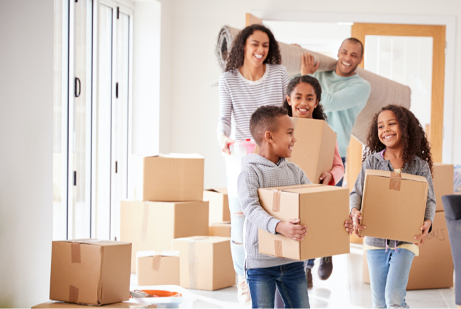 A family moving boxes together.