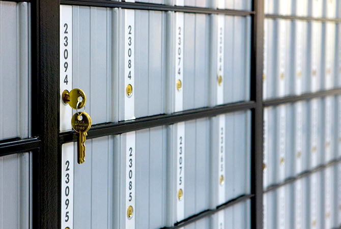 A PO Box with a key in the lock.