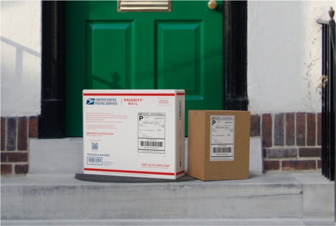 Priority Mail boxes on a house porch awaiting pickup.