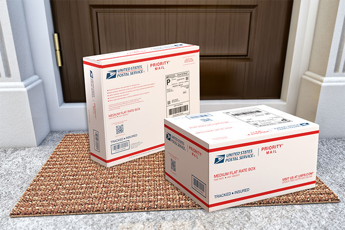 Priority Mail boxes on a house porch awaiting pickup.