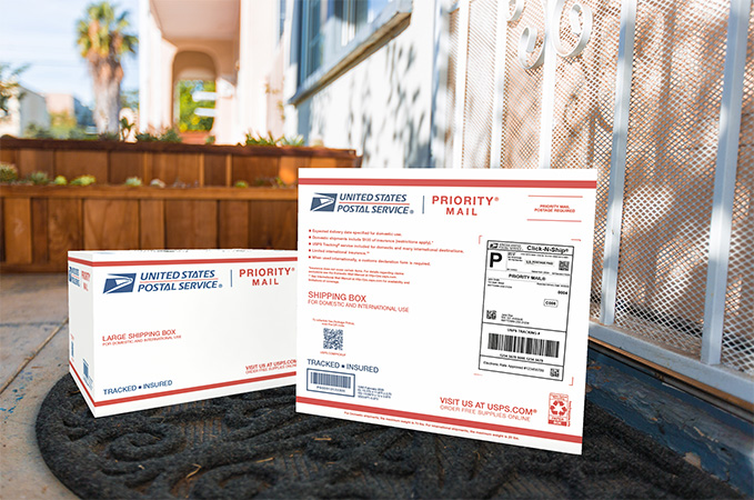 Priority Mail boxes on a house porch awaiting pickup.