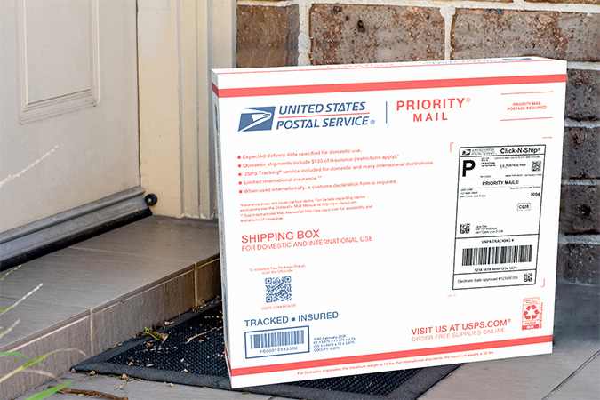 Priority Mail boxes on a house porch awaiting pickup.